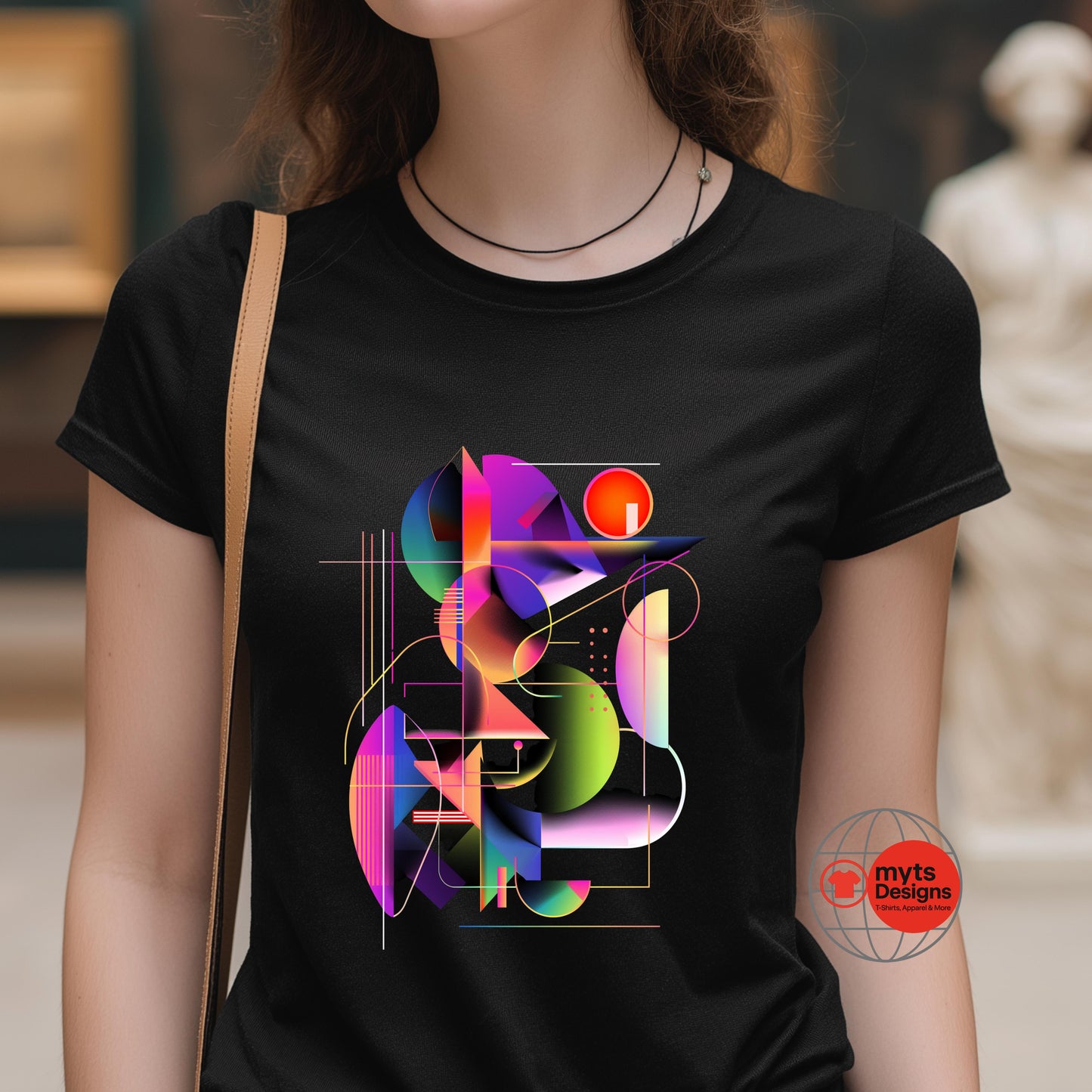 Person wearing a black t-shirt with colorful geometric design and 'myts Designs' logo.