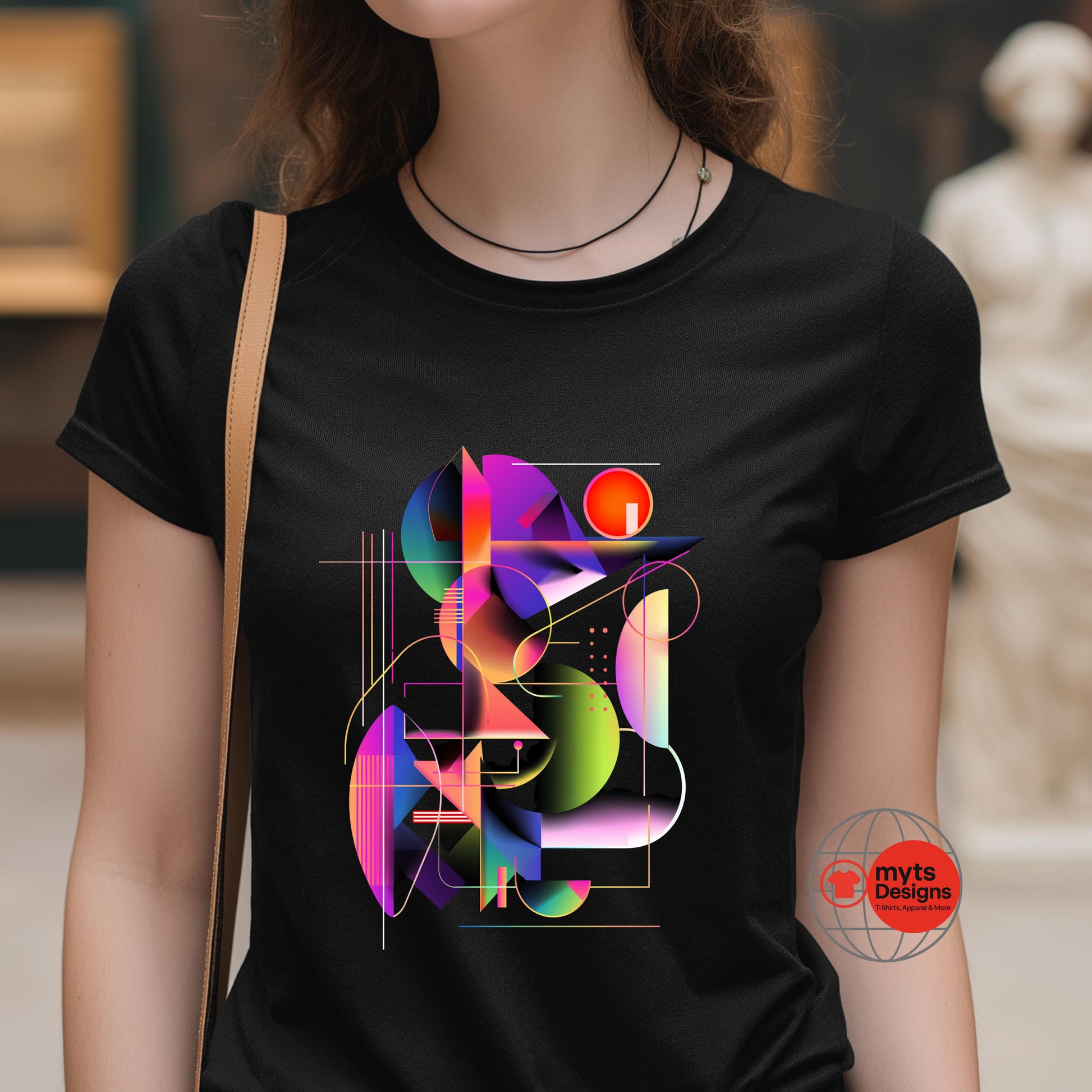 Person wearing a black t-shirt with colorful geometric design and 'myts Designs' logo.