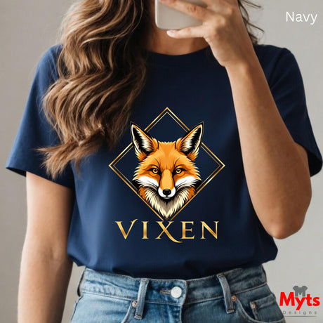 Person wearing a navy blue t-shirt with a fox graphic and 'Vixen' text, holding a phone.