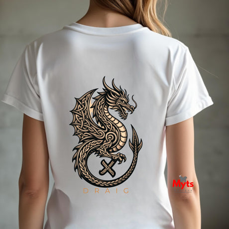 A person shown from the back wearing a white short-sleeve T-shirt with a large black and tan dragon graphic printed across the back, plus the word 'DRAIC' below the graphic. The background is a softly blurred gray indoor setting.