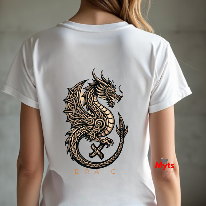 A person shown from the back wearing a white short-sleeve T-shirt with a large black and tan dragon graphic printed across the back, plus the word 'DRAIC' below the graphic. The background is a softly blurred gray indoor setting.