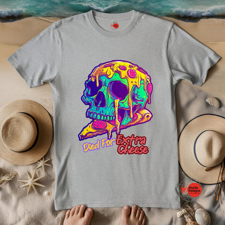 Gray t-shirt with a colorful skull design and 'Died for Extra Cheese' text on a sandy background.