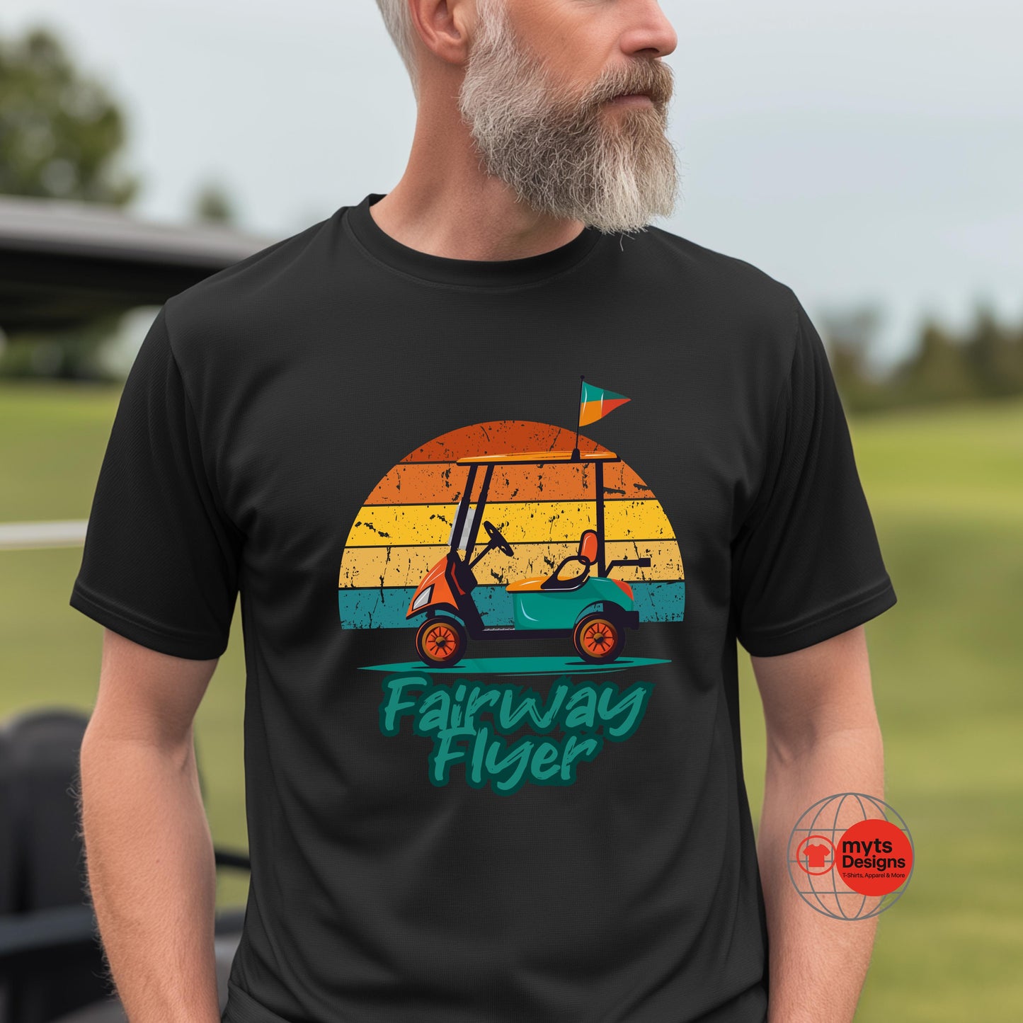 Man wearing a black t-shirt with a golf cart graphic and 'Fairway Flyer' text on a golf course.