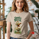 Woman wearing a t-shirt with 'Farka Duck' graphic design in an indoor setting.