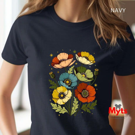 A woman wearing a navy blue short-sleeve t-shirt with a colorful graphic of stylized flowers and green leaves. The text 'NAVY' is visible in the top right corner, and a 'Myts' brand logo is in the bottom right corner.