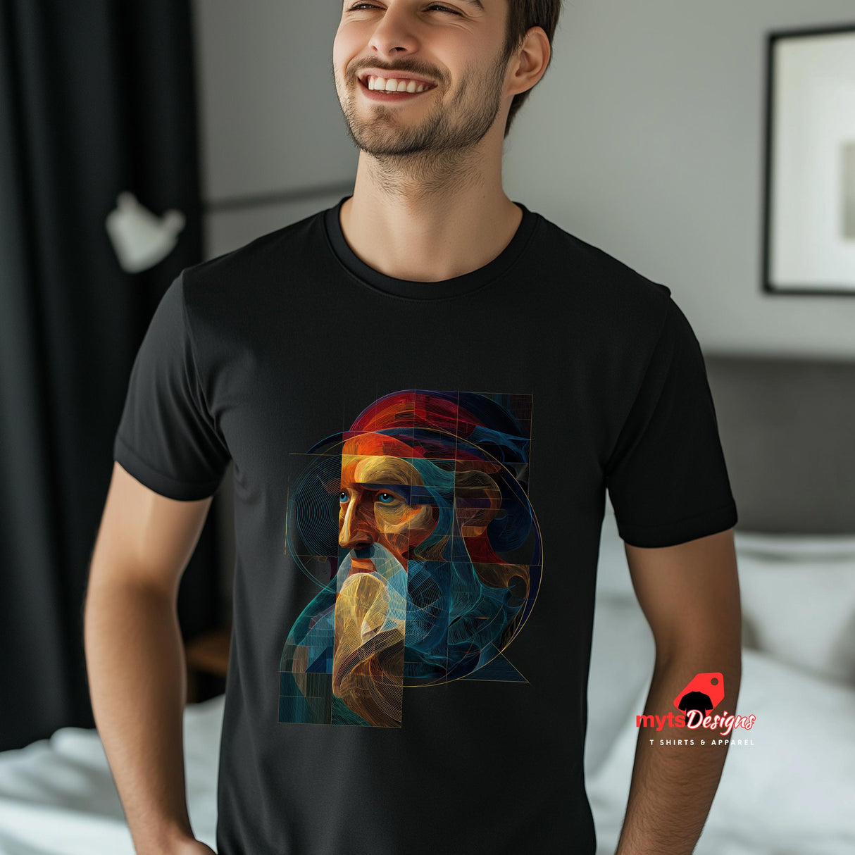 Man wearing a black t-shirt with a colorful graphic design, standing in a room.
