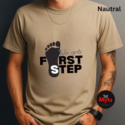 Person wearing a natural t-shirt with a motivational graphic and text 'Take your first step' on a dark background.