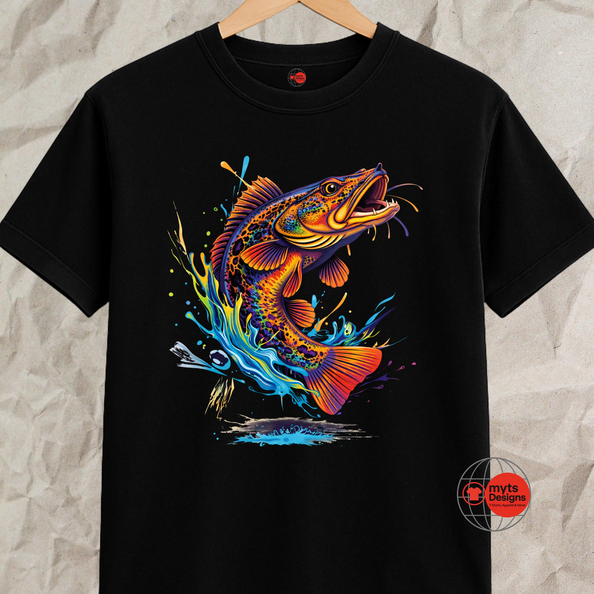 Black t-shirt with a colorful fish graphic on a textured gray background