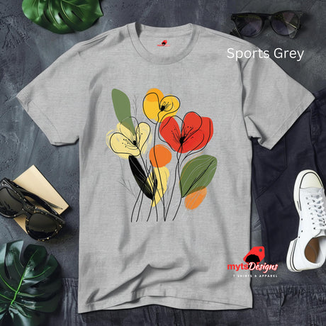 Sports Grey t-shirt featuring minimalist floral line art with abstract red, yellow, and orange flowers and green leaves, laid flat on a wooden surface with rolled sleeves.