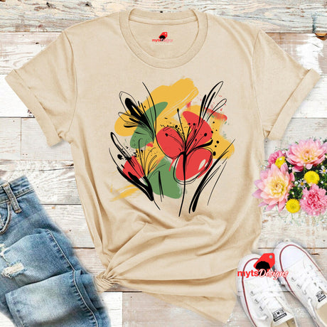 Natural T-shirt with bold abstract floral design featuring red blooms, yellow and green brushstrokes, and black line art accents, from MytsDesigns.com
