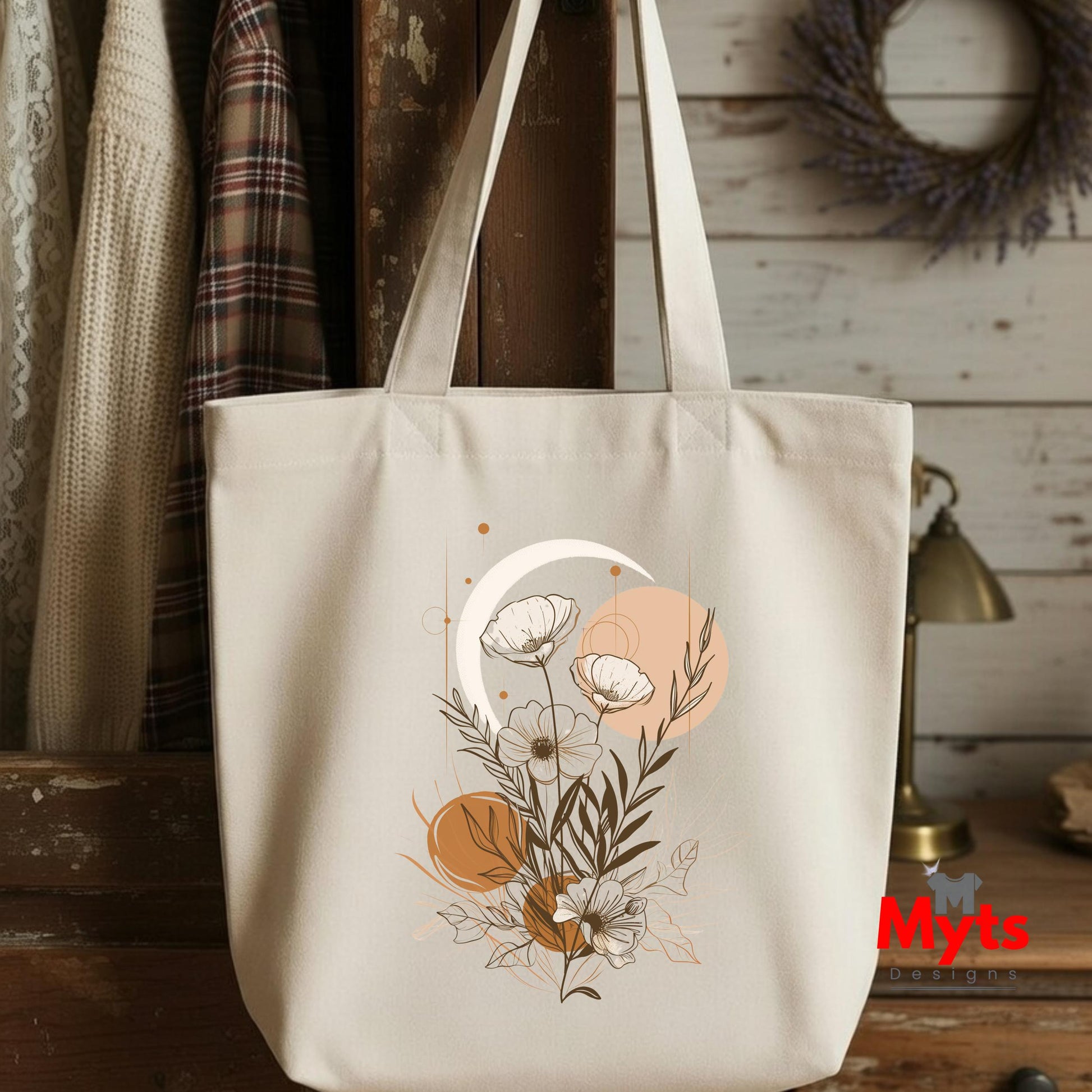 Beige tote bag with floral design on a wooden surface