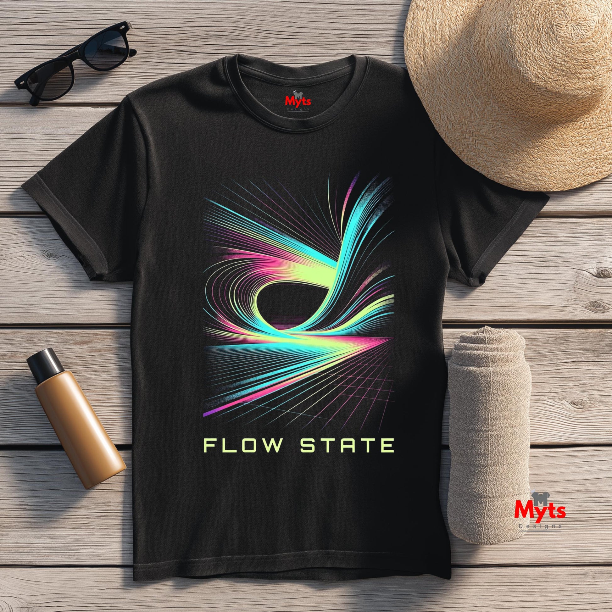 Black t-shirt with colorful 'Flow State' design on a wooden surface with accessories.
