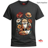 A dark heather gray t-shirt with a detailed graphic of a fox surrounded by flowers, labeled 'Dark Heather' at the top right. The shirt features a central illustration of a fox sitting in a bowl with floral elements, and the text 'FOXY VIXEN' printed below the graphic.