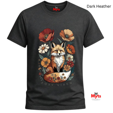 A dark heather gray t-shirt with a detailed graphic of a fox surrounded by flowers, labeled 'Dark Heather' at the top right. The shirt features a central illustration of a fox sitting in a bowl with floral elements, and the text 'FOXY VIXEN' printed below the graphic.