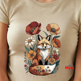 A close-up of a Natural t-shirt featuring a colorful graphic of a fox surrounded by wildflowers, with the text 'FOXY VIXEN' printed below. A red 'Myts' logo is visible in the bottom right of the graphic.