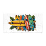 Colorful surfboard design on a white towel with decorative elements.