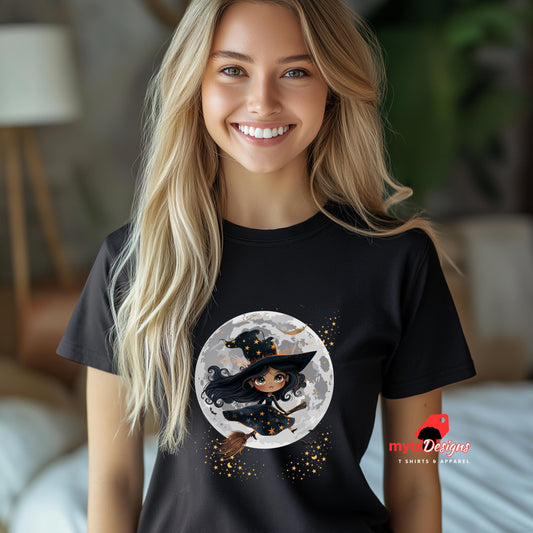 Woman wearing a black t-shirt with a witch graphic design, standing in a blurred indoor setting.