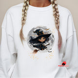 White sweatshirt with a witch graphic on a plain background