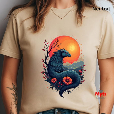 Beige t-shirt with a dragon and sunset design, worn by a person.