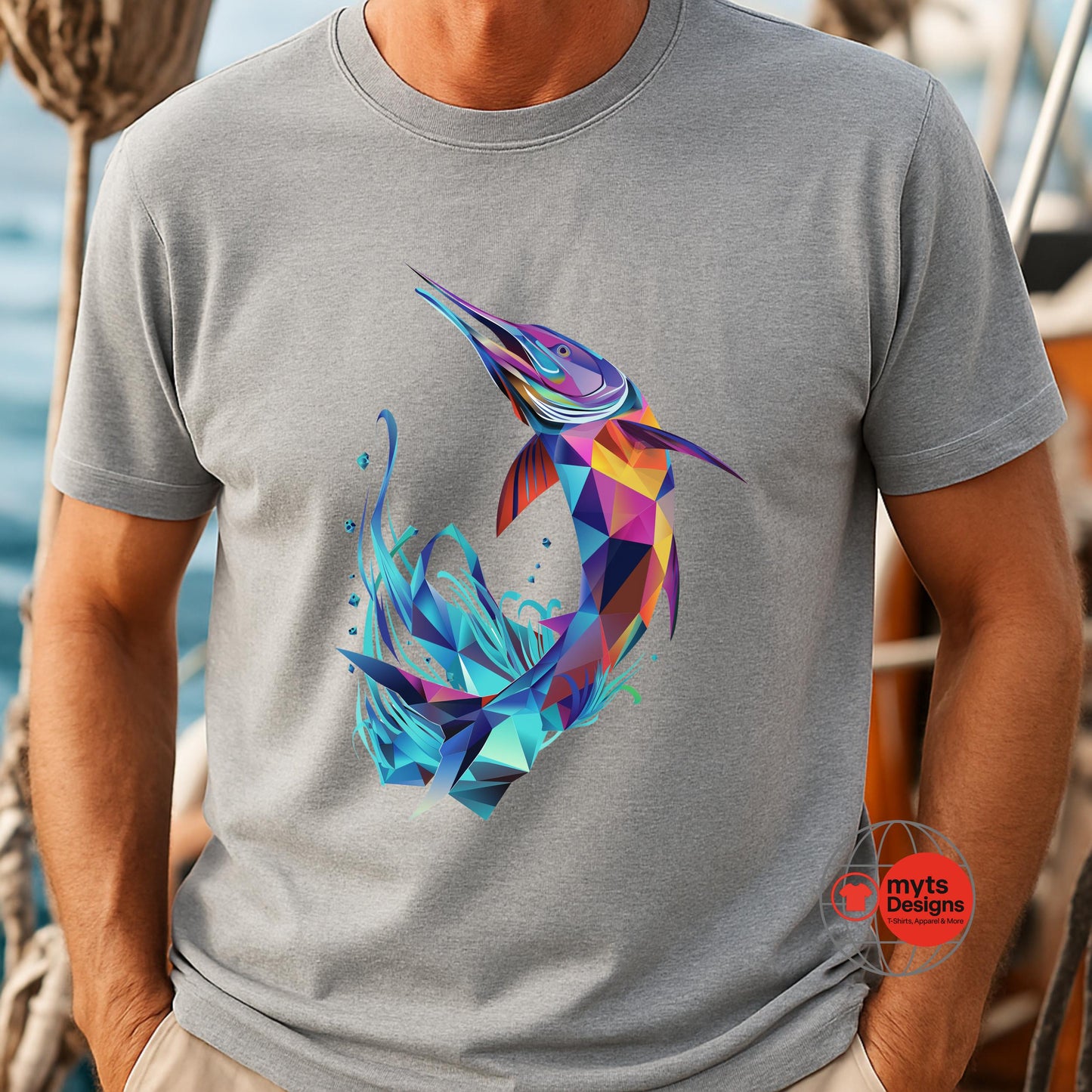 Person wearing a gray t-shirt with a colorful geometric penguin design, standing on a boat.