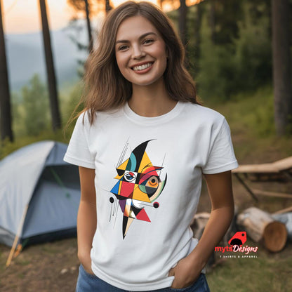 “White unisex T-shirt featuring an abstract geometric face design inspired by Picasso’s Cubist art, with bold shapes and vibrant colors, worn by a woman at a camp site, available from MytsDesigns.com”