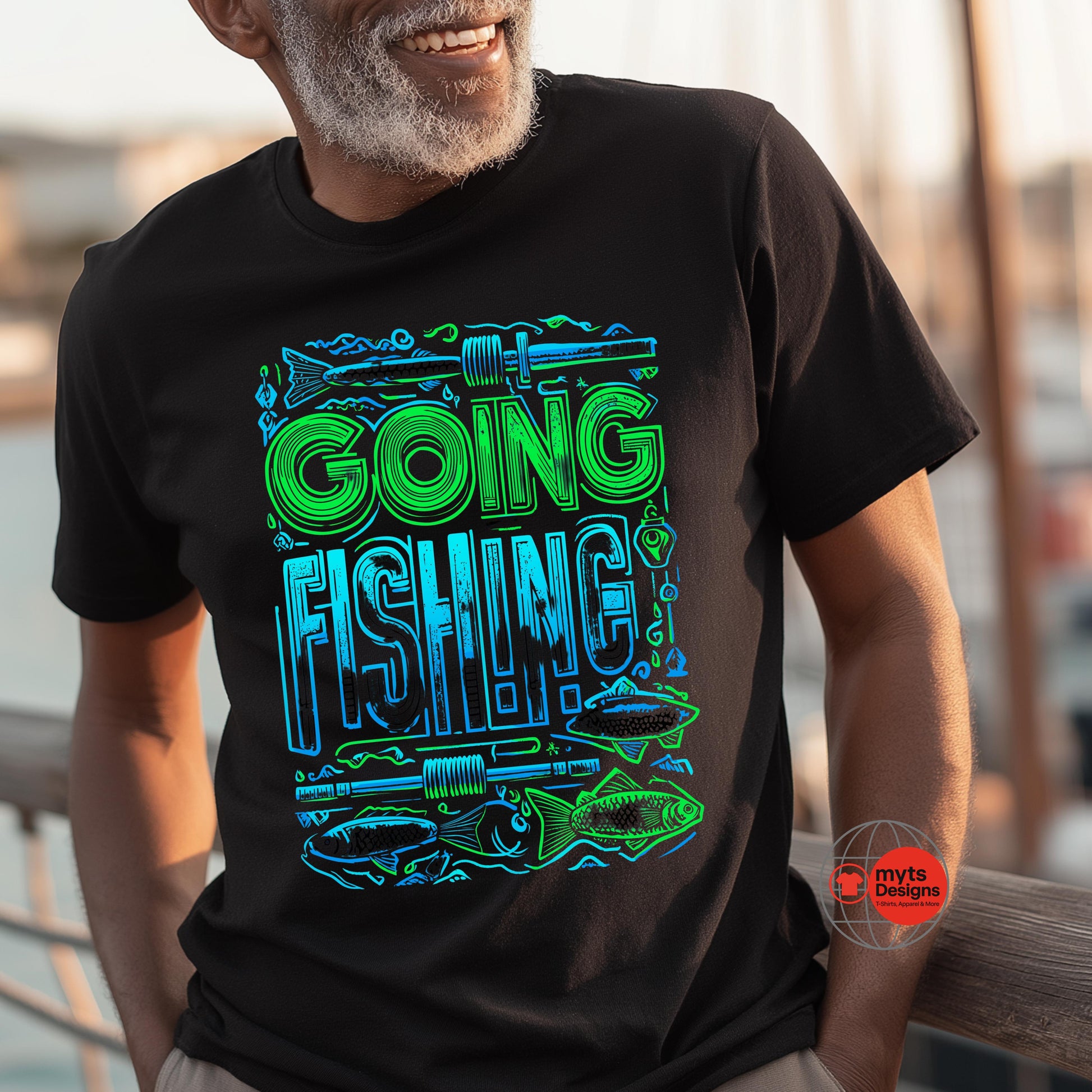 Man wearing a black t-shirt with 'Going Fishing' graphic design outdoors.