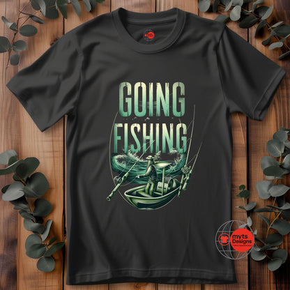 Black t-shirt with 'Going Fishing' graphic design on a wooden surface with eucalyptus leaves.