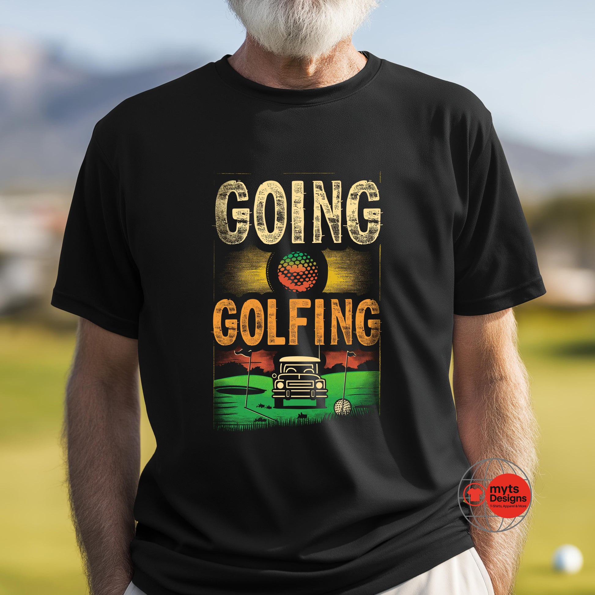 Person wearing a black t-shirt with 'Going Golfing' graphic design on a golf course.