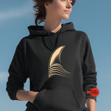 Person wearing a black hoodie with a gold design on a blue background