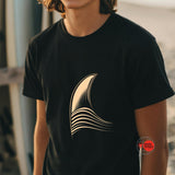 Person wearing a black t-shirt with a gold abstract design, brand 'mythodesigns' visible.
