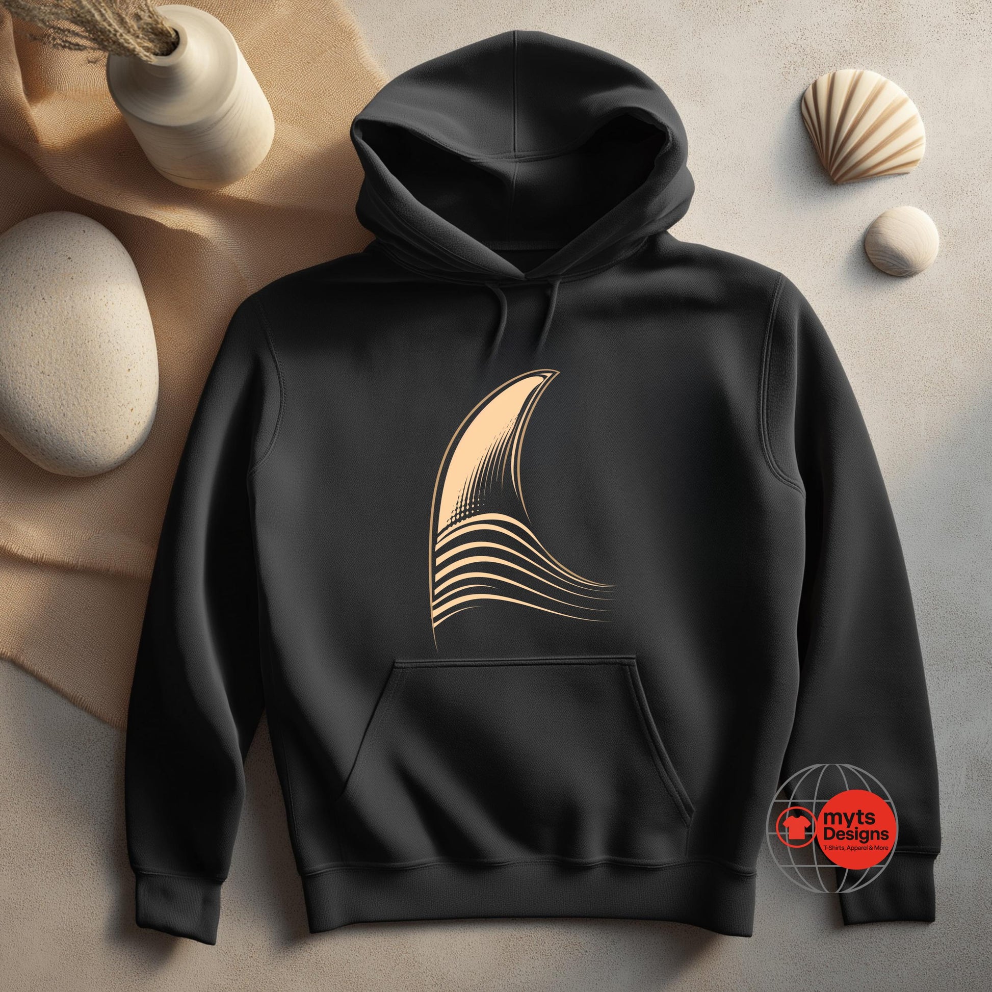 Black hoodie with a gold design on a neutral background