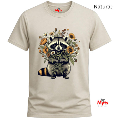A Natural crewneck t-shirt with a graphic of a raccoon holding a bouquet of wildflowers. The text 'Natural' is printed in black at the top right, and the red 'Myts' brand logo is visible on the inner neck label and as a watermark in the bottom right corner.