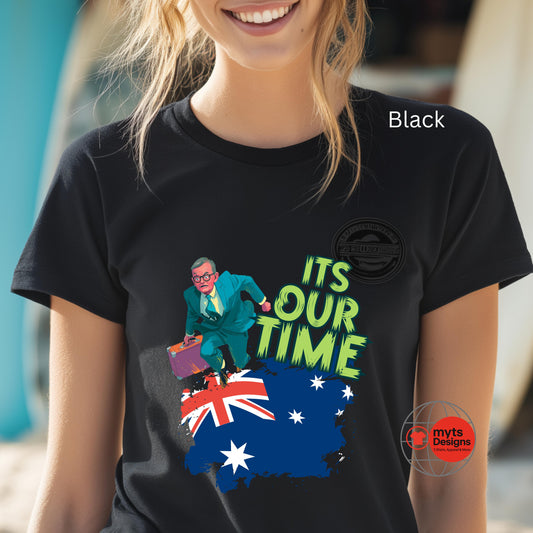 Person wearing a black t-shirt with a graphic design and text, featuring a map of Australia and a person in a suit.