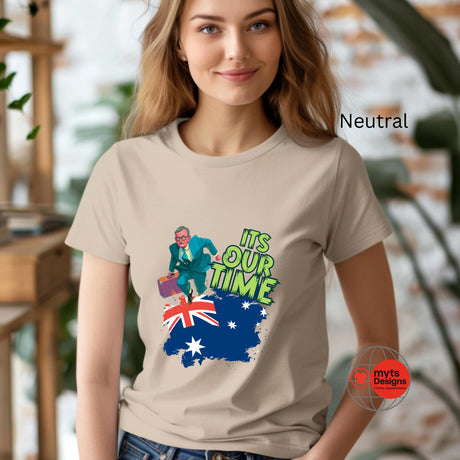 A woman wearing a Neutral t-shirt with a graphic design and text, standing indoors.