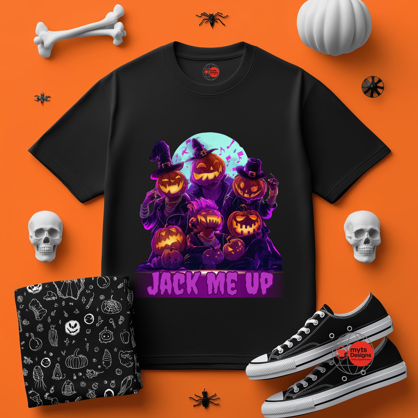Black t-shirt with Halloween-themed design on an orange background with pumpkins, skulls, and bones.
