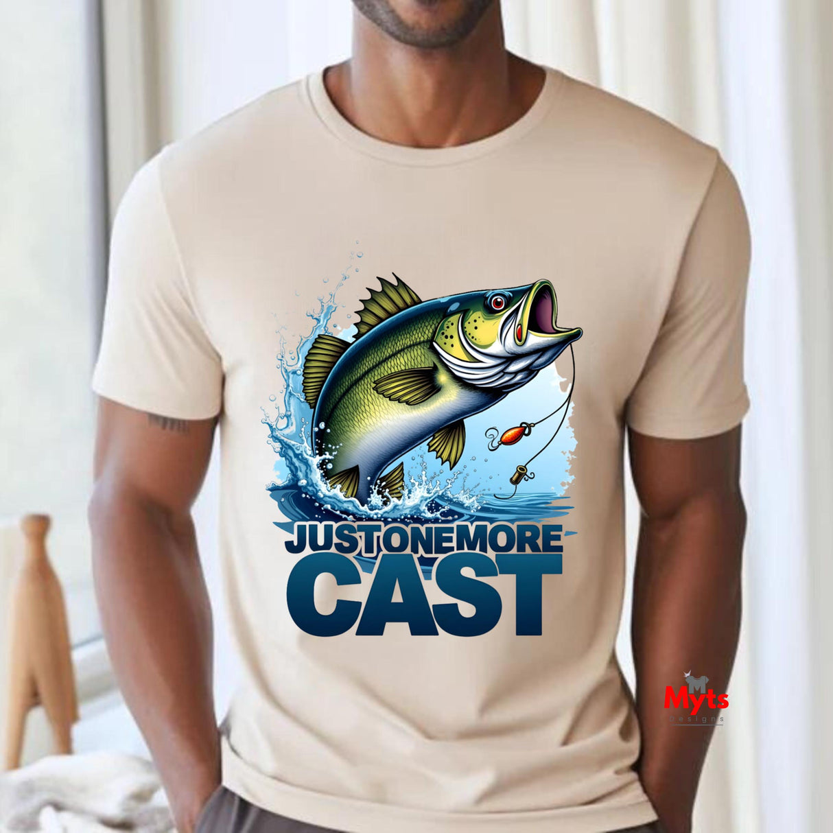 Just One More Cast fishing T-shirt with jumping fish graphic and lure on Natural unisex angler shirt