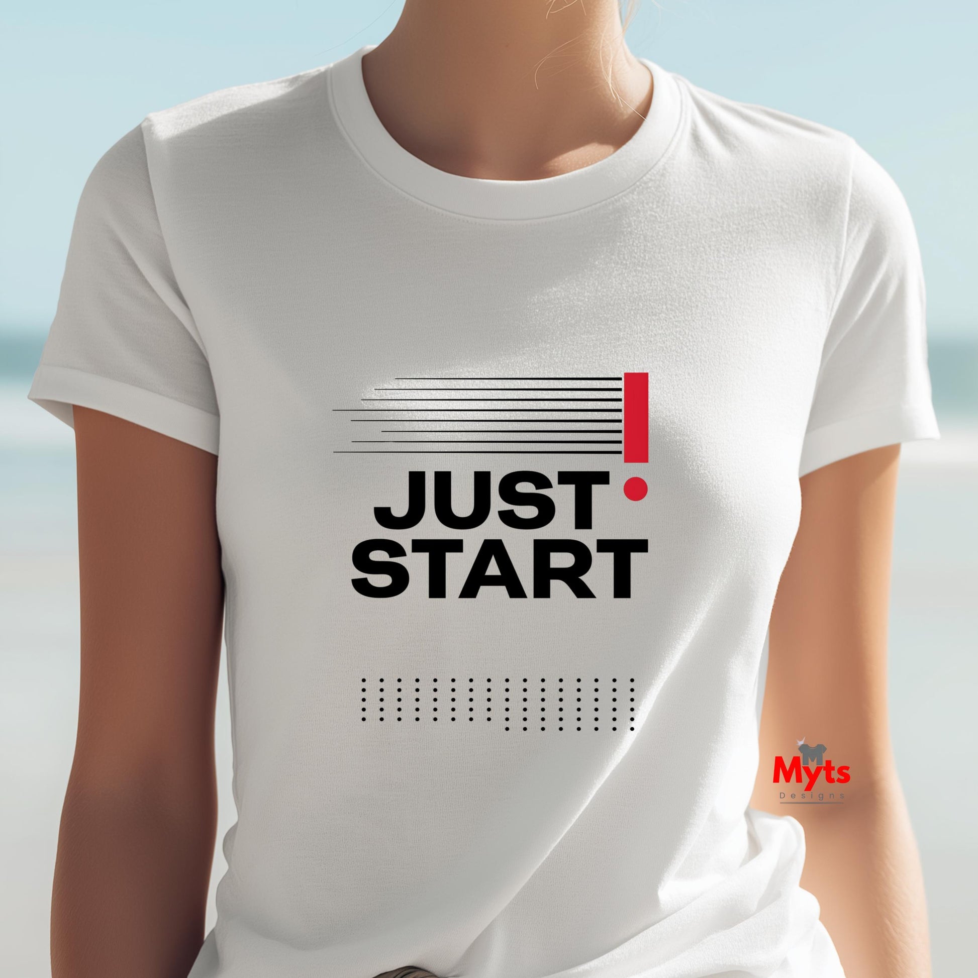 White t-shirt with 'JUST START!' text on a blurred beach background