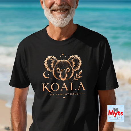 A man wearing a black t-shirt with a gold koala graphic and the text 'KOALA MY TREE, MY HOME' stands against a beach background. A 'Myts Designs' logo is visible in the bottom right corner.