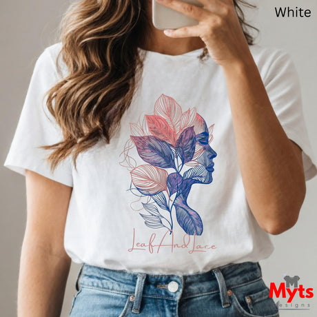 Person wearing a white t-shirt with a colorful leaf design and 'Myts Designs' branding.