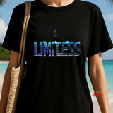 Person wearing a black t-shirt with 'LIMITLESS' printed on it, standing on a beach.