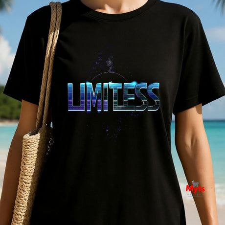 Person wearing a black t-shirt with 'LIMITLESS' printed on it, standing on a beach.