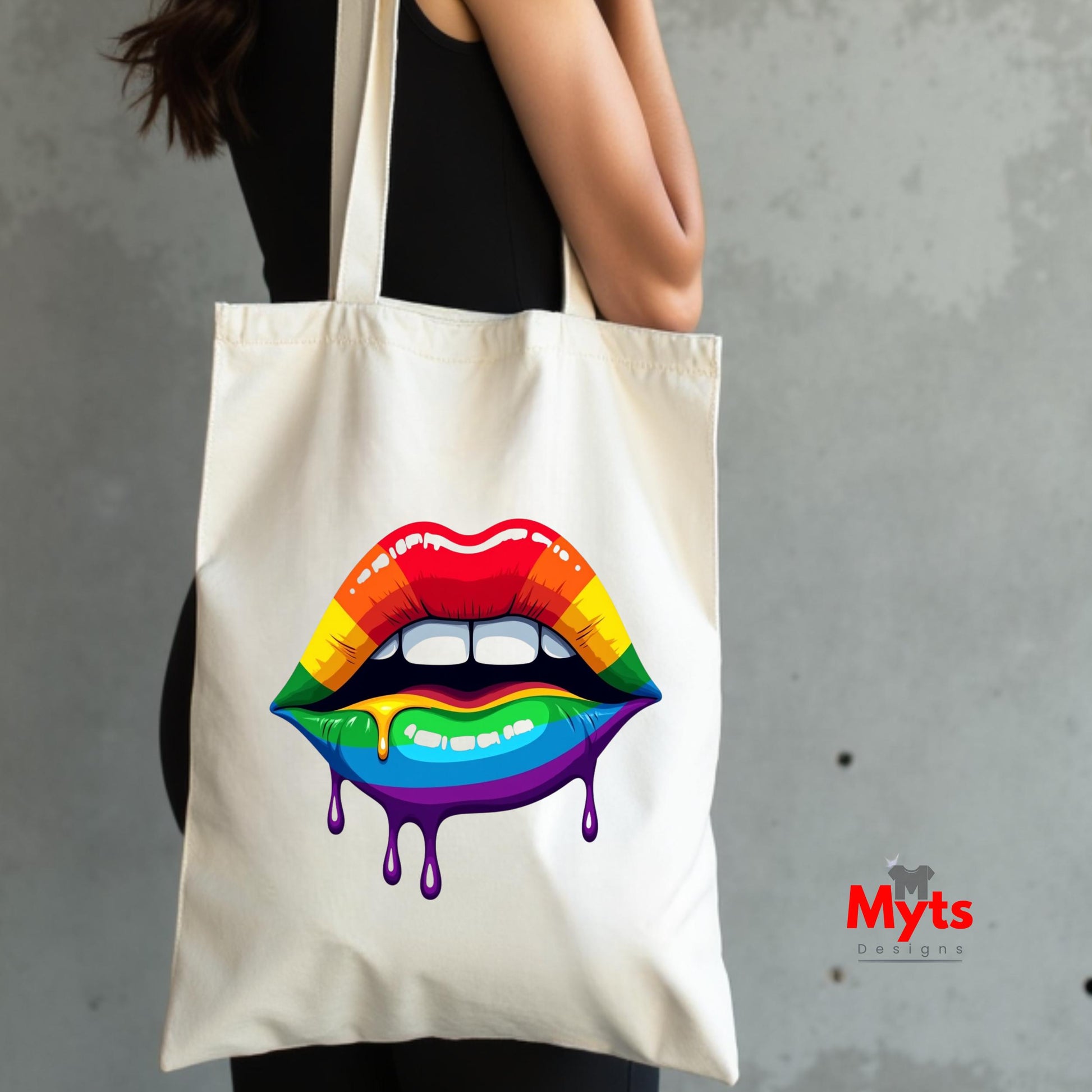 Tote bag with rainbow lips design held by a person against a gray background