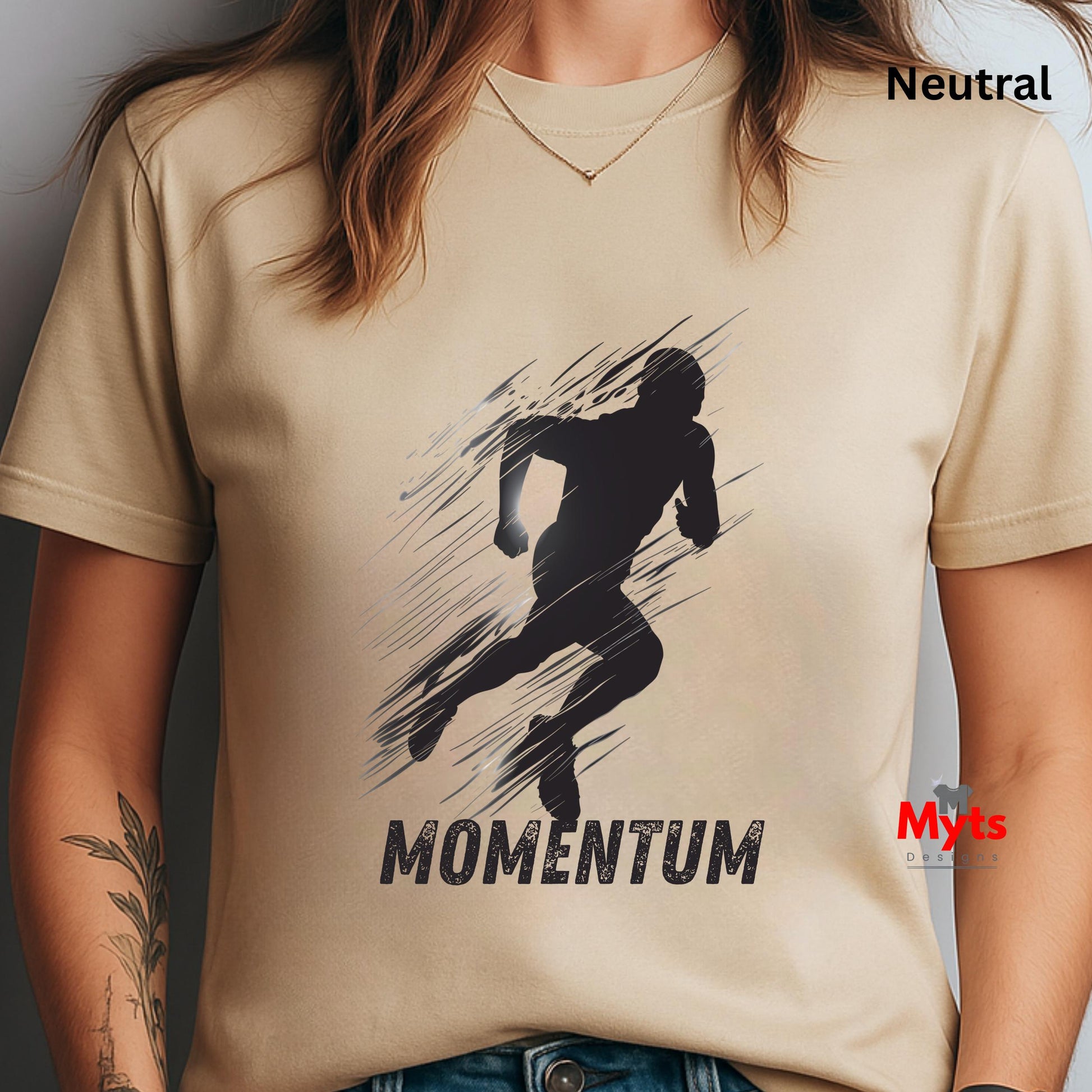 Beige t-shirt with a black silhouette graphic and 'MOMENTUM' text, worn by a person.