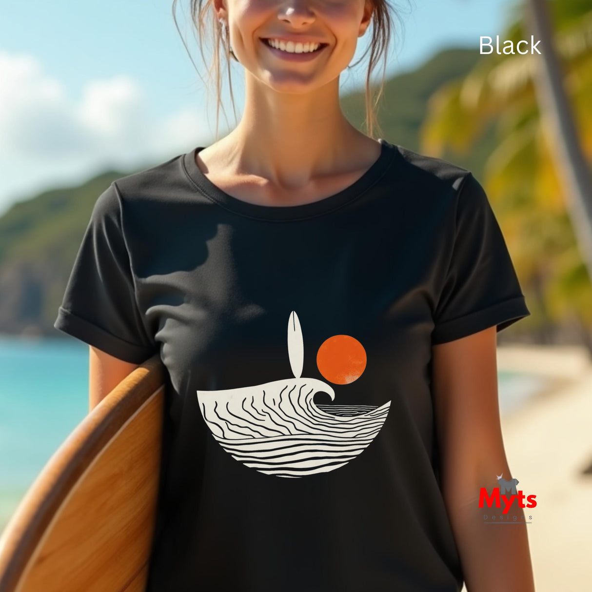Person wearing a black t-shirt with a graphic design on a beach