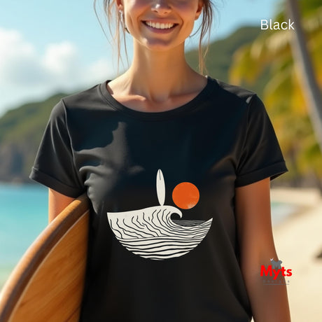 Person wearing a black t-shirt with a graphic design on a beach
