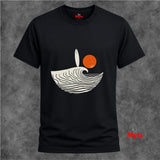 Black t-shirt with a wave and sun design on a gray background