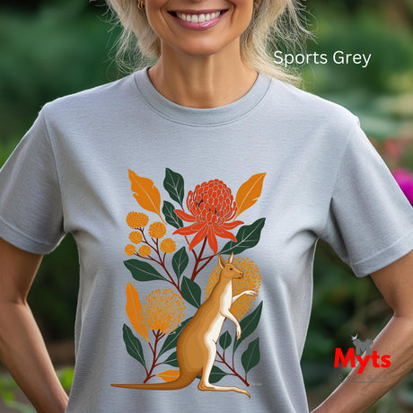 A woman wearing a sports grey t-shirt with a colorful graphic of a kangaroo surrounded by orange flowers and green leaves. The text 'Sports Grey' is visible in the top right, and a red 'Myts' logo is visible in the bottom right.
