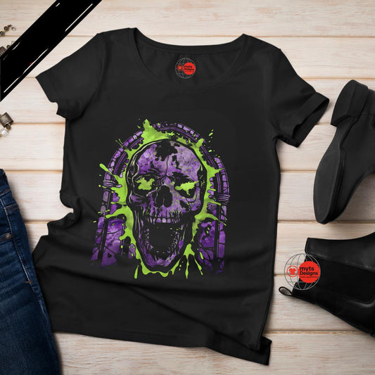 Black t-shirt with a purple and green skull design on a wooden surface.