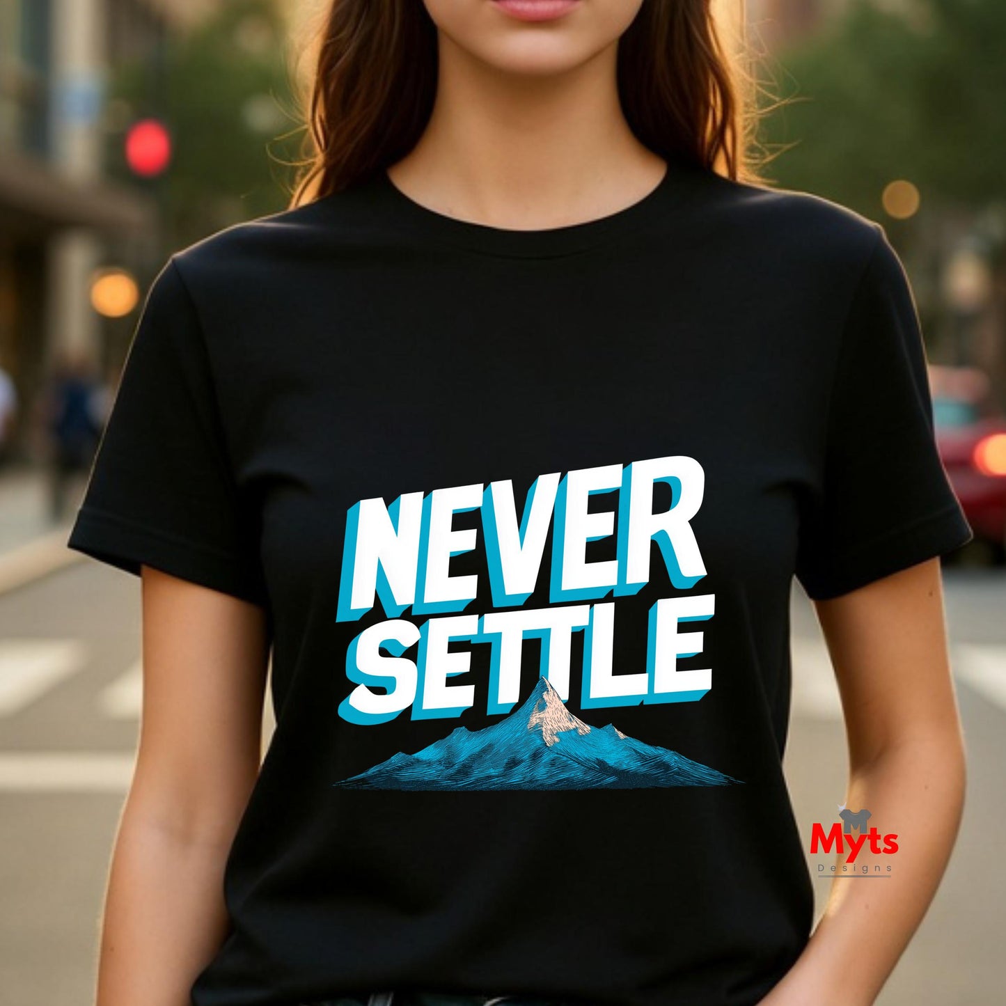 Person wearing a black t-shirt with 'Never Settle' graphic and mountain design, brand 'Myts' visible.