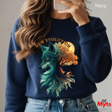 A person wearing a navy crewneck sweatshirt with a large graphic print of a wolf and tree, holding a phone to take a mirror selfie. The text 'Navy' is in the top right corner, and a 'Myts designs' logo is in the bottom right corner.